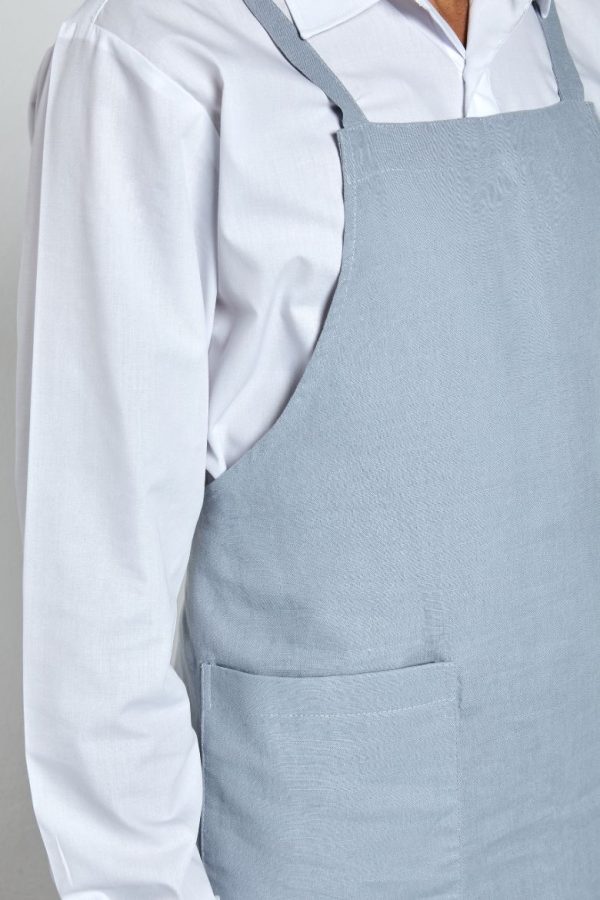 Pormenor do bolso do avental de cozinha de tecido